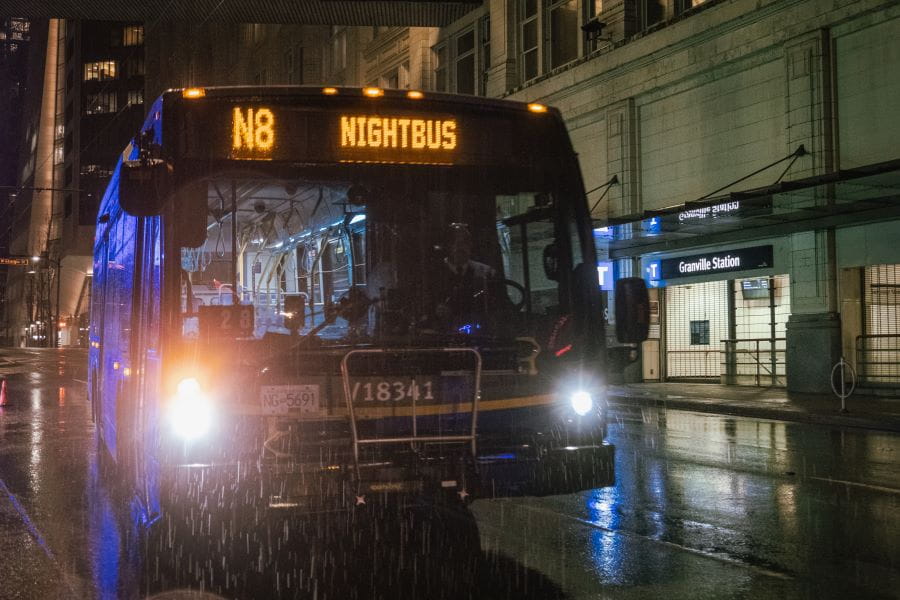 NightBus on rainy street at night outside Granville Station
