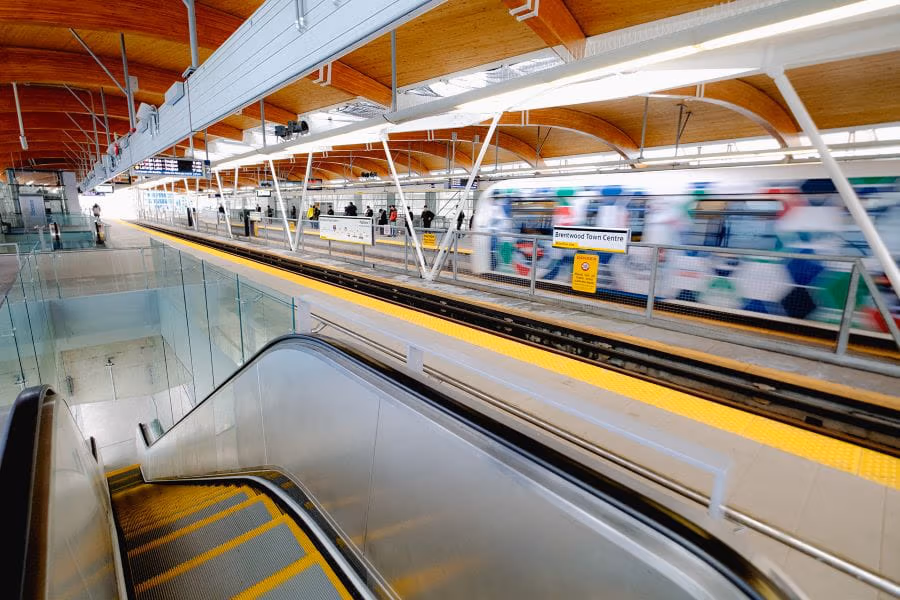 Escalator and SkyTrain platform at Brentwood Town Centre Station