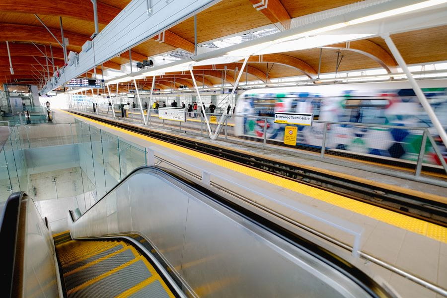 Escalator and SkyTrain platform at Brentwood Town Centre Station