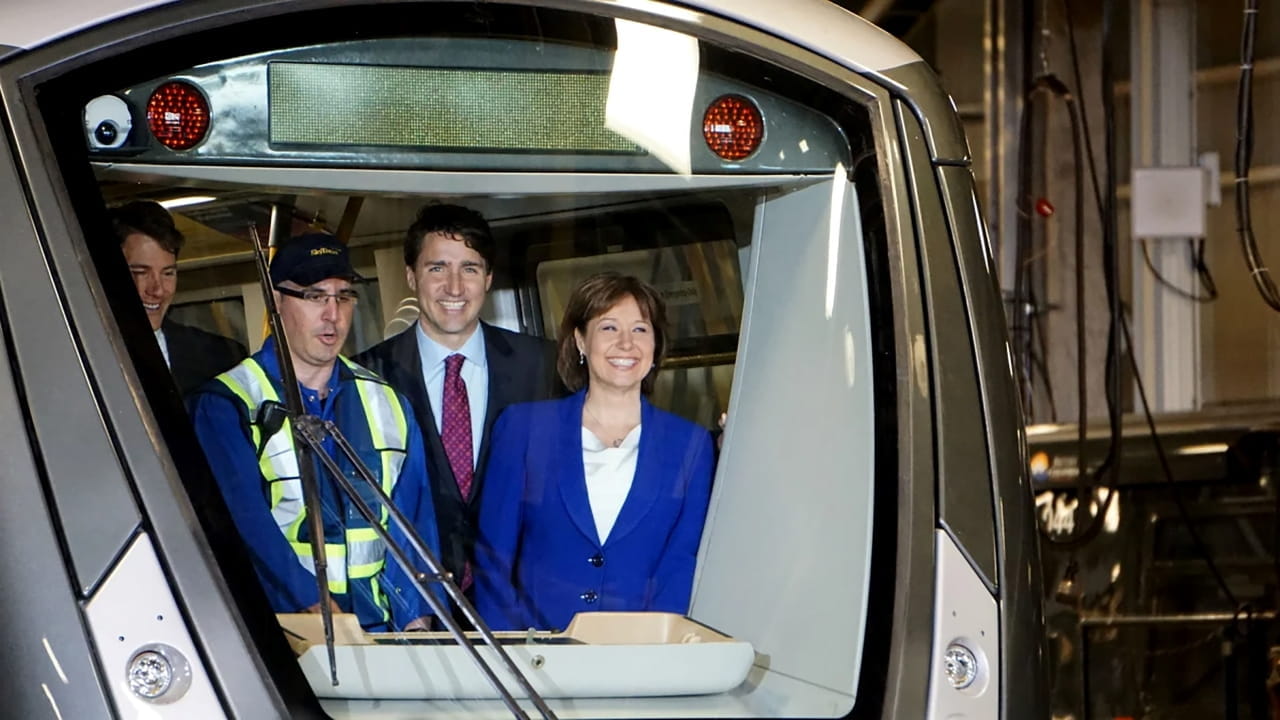 Politicians and a SkyTrain crew member are on board the very first Mark III SkyTrain to enter service in 2016